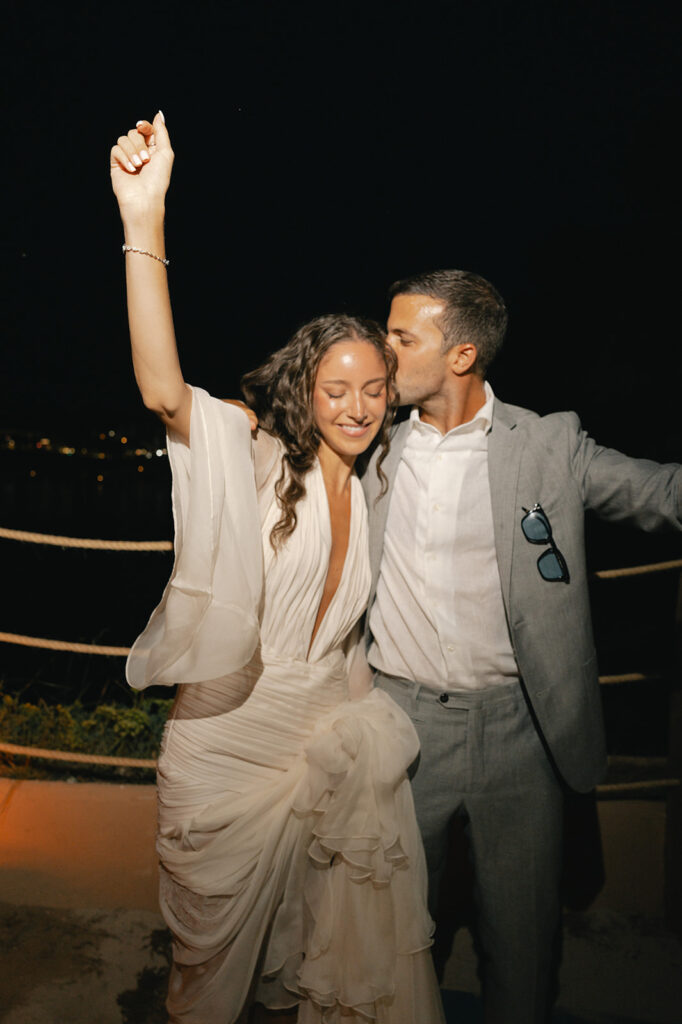 Elena and Mo dancing with flamenco musicians during their welcome party